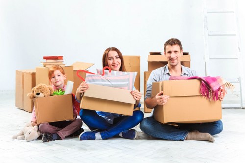 Professional removalists loading household items for transport