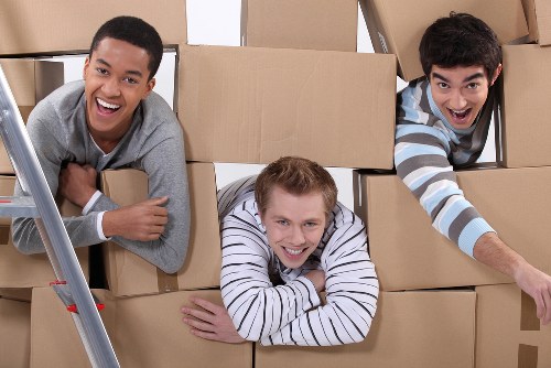 Office removals team preparing business furniture for a move in Plumstead