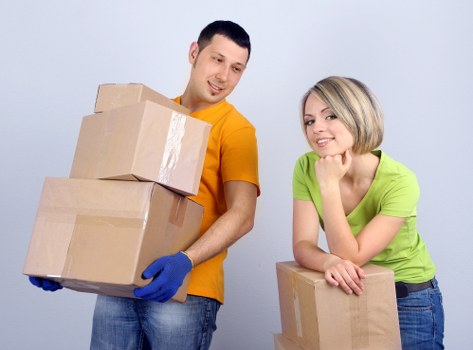 Packed moving boxes and furniture ready for local removals in Plumstead