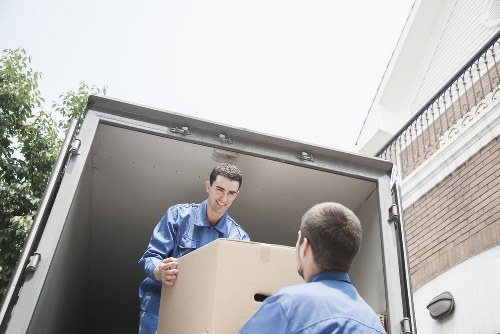 Driver and mover reviewing safety checks beside the van